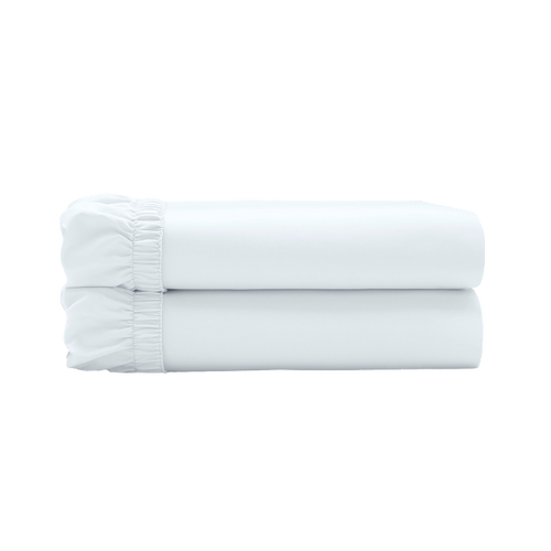 Two white fitted sheets folded and stacked.
